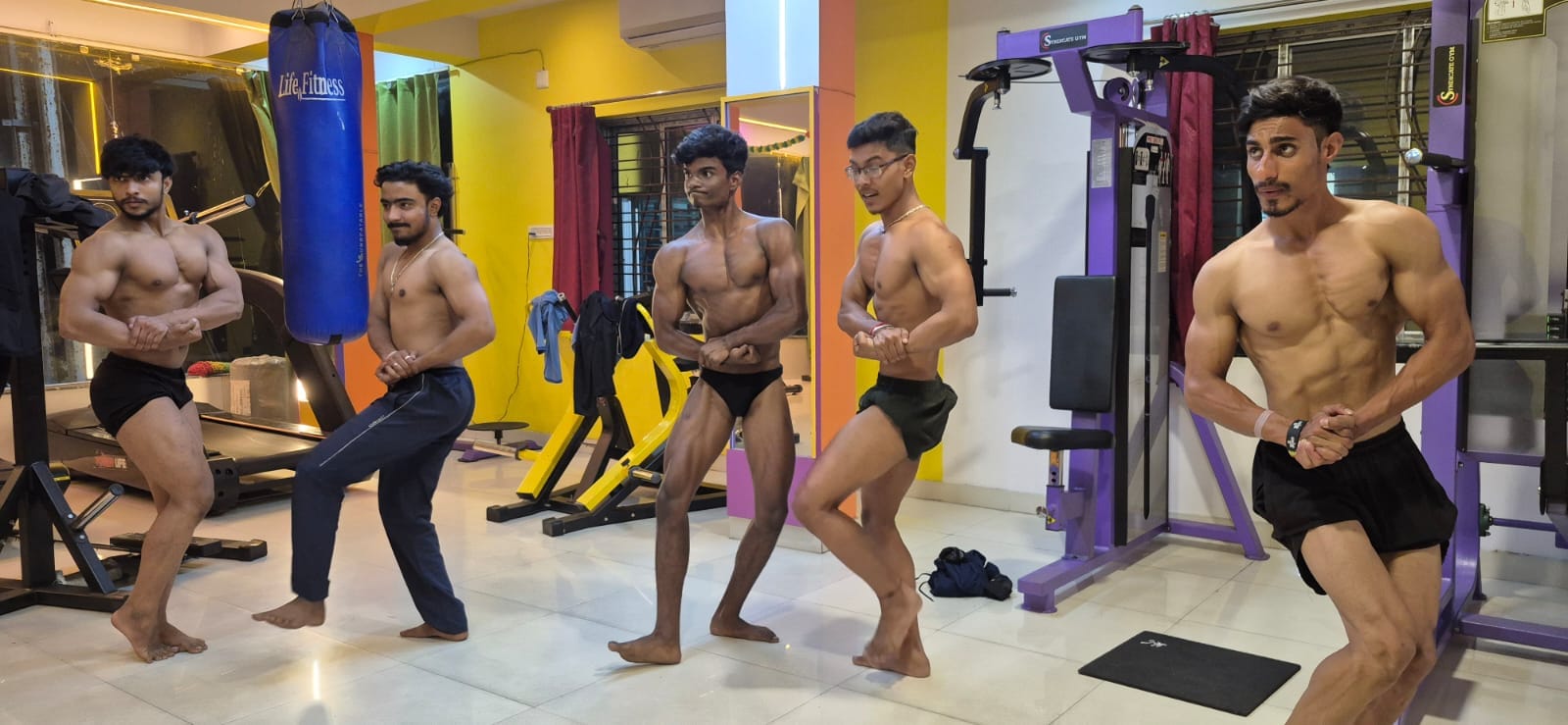 Male bodybuilders training inside Goldie's Gym Durgapur