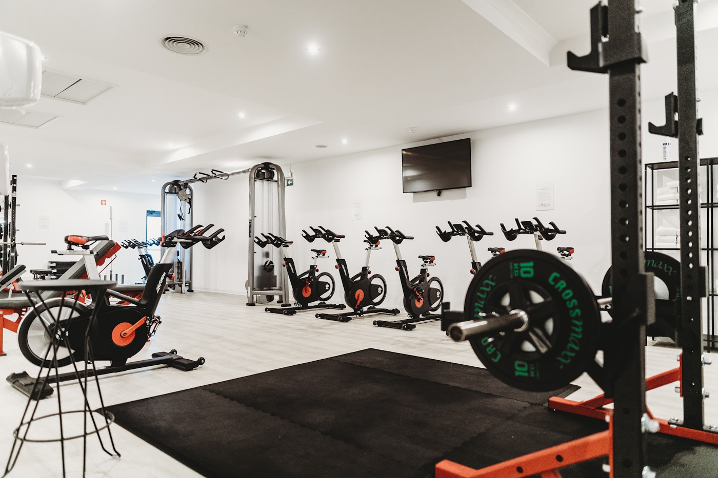Open gym with squat rack, barbell and functional training equipment
