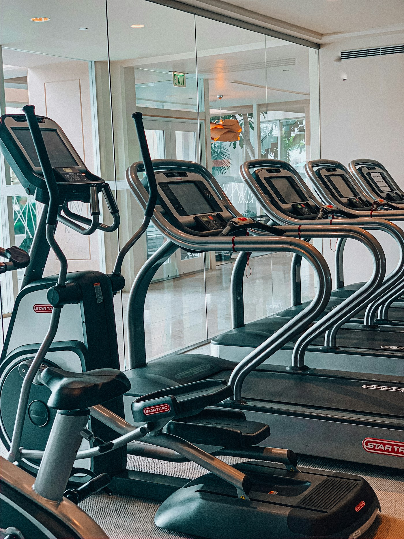 Empty cardio area with treadmills and elliptical machines
