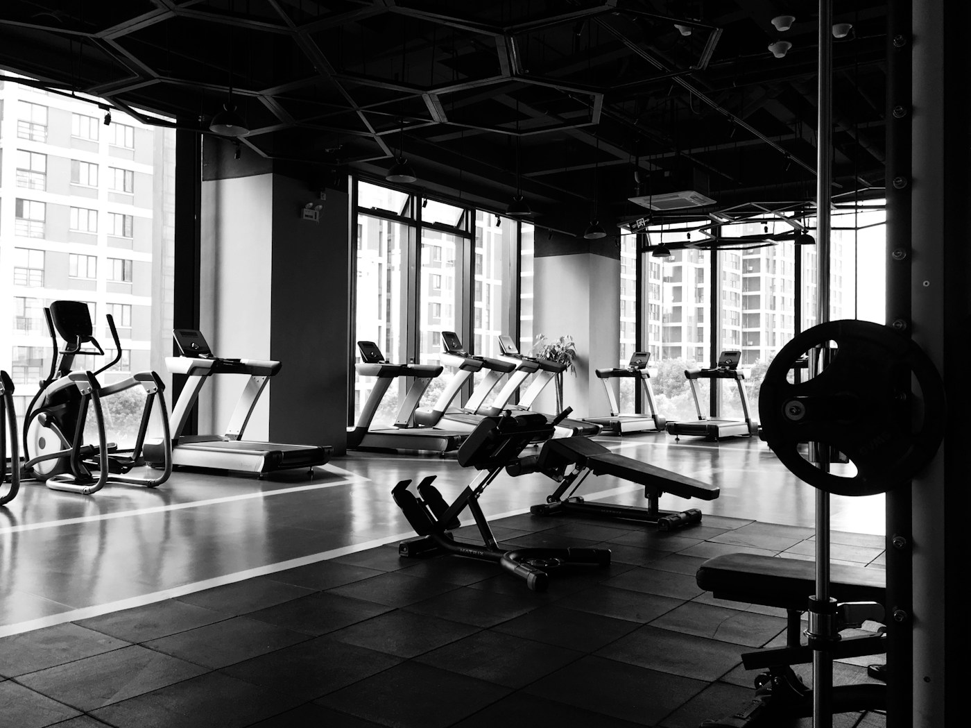 Empty gym interior with row of strength and resistance machines